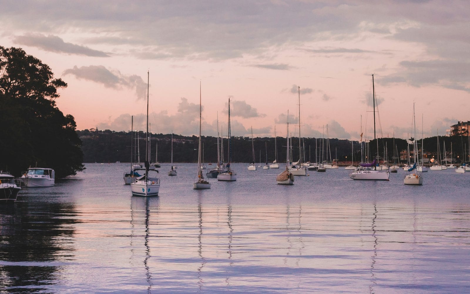 Moored boats on Sydney Harbour below Potts Point, where the walk to the water is the reason guests pay to stay.